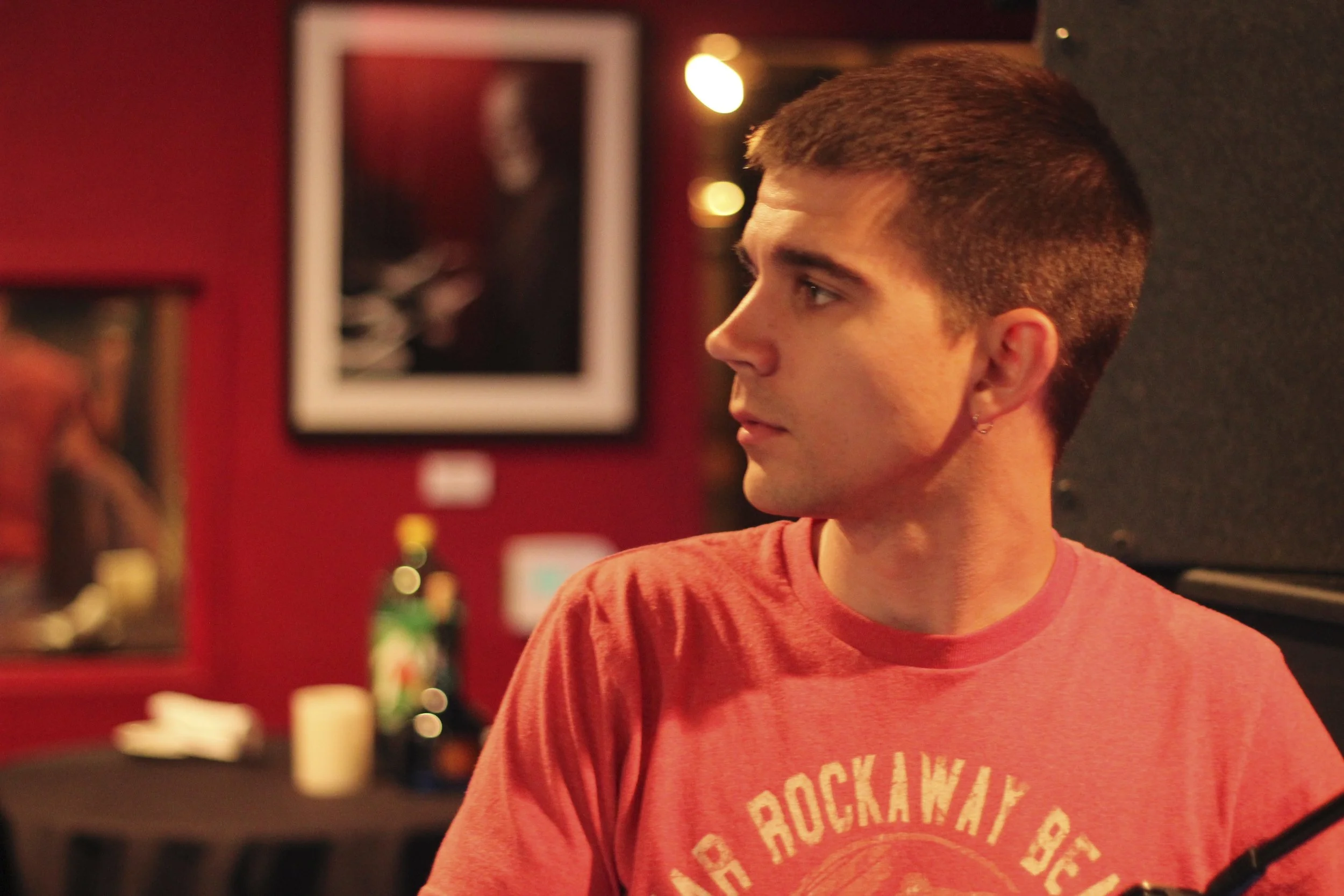 Candid profile of Lee Huff in a red shirt