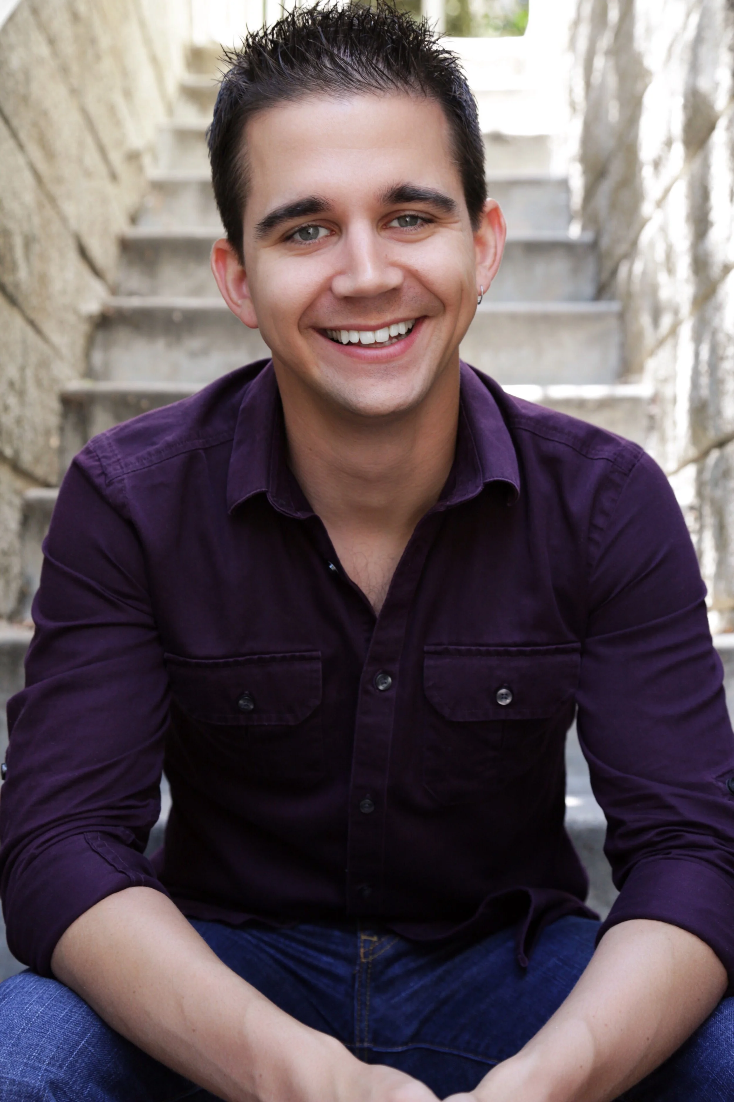 Lee Huff smiling in a purple shirt