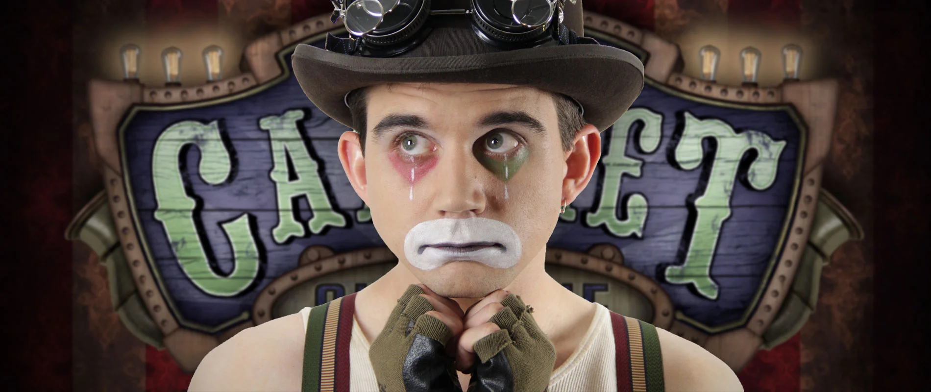 Sad Clown Lee resting his hands beneath his chin
